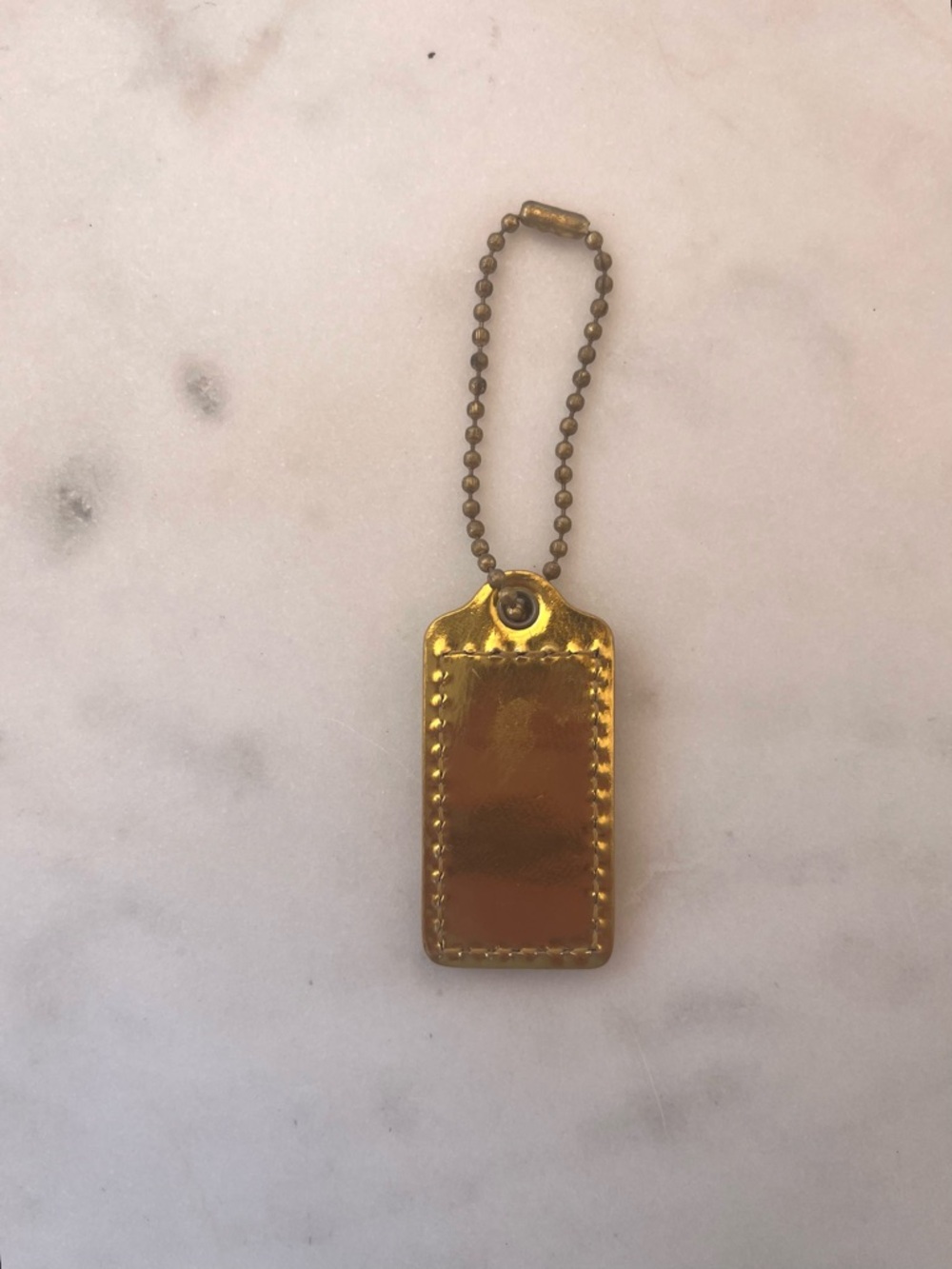COACH Vintage Leather Hang Tag. Mirrored Gold - Picture 2 of 4